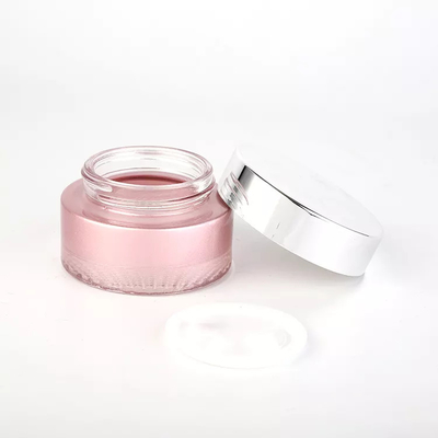 ピンク色の絵画スキン ケアのクリームのための帽子の上のガラス化粧品の瓶50gの銀ねじ