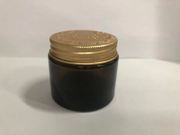 円形のガラス クリーム色の瓶の化粧品のアルミニウムふたが付いている包装のローションのクリーム色の容器